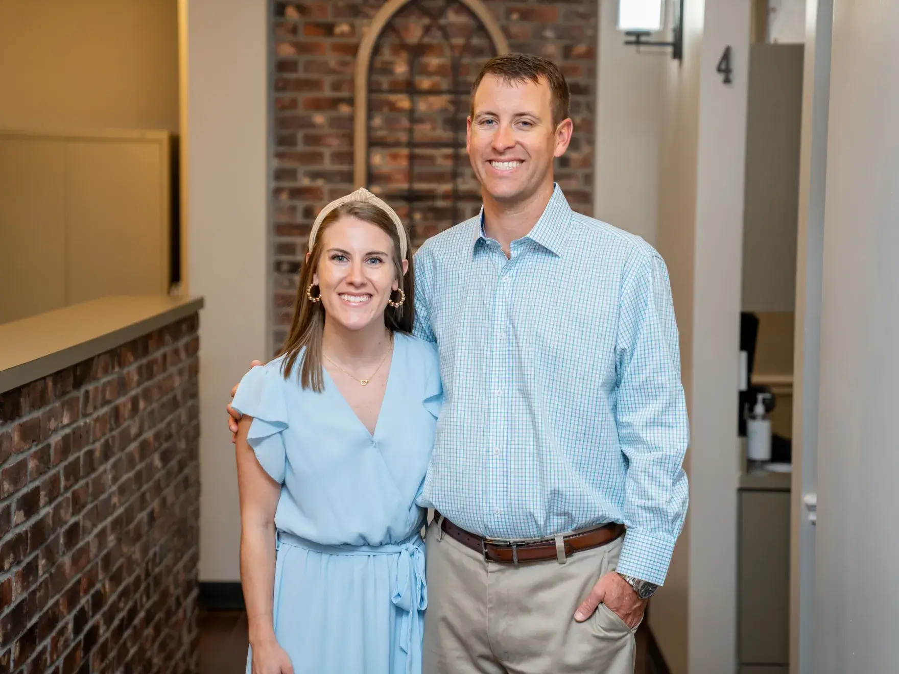a man and a woman standing next to each other