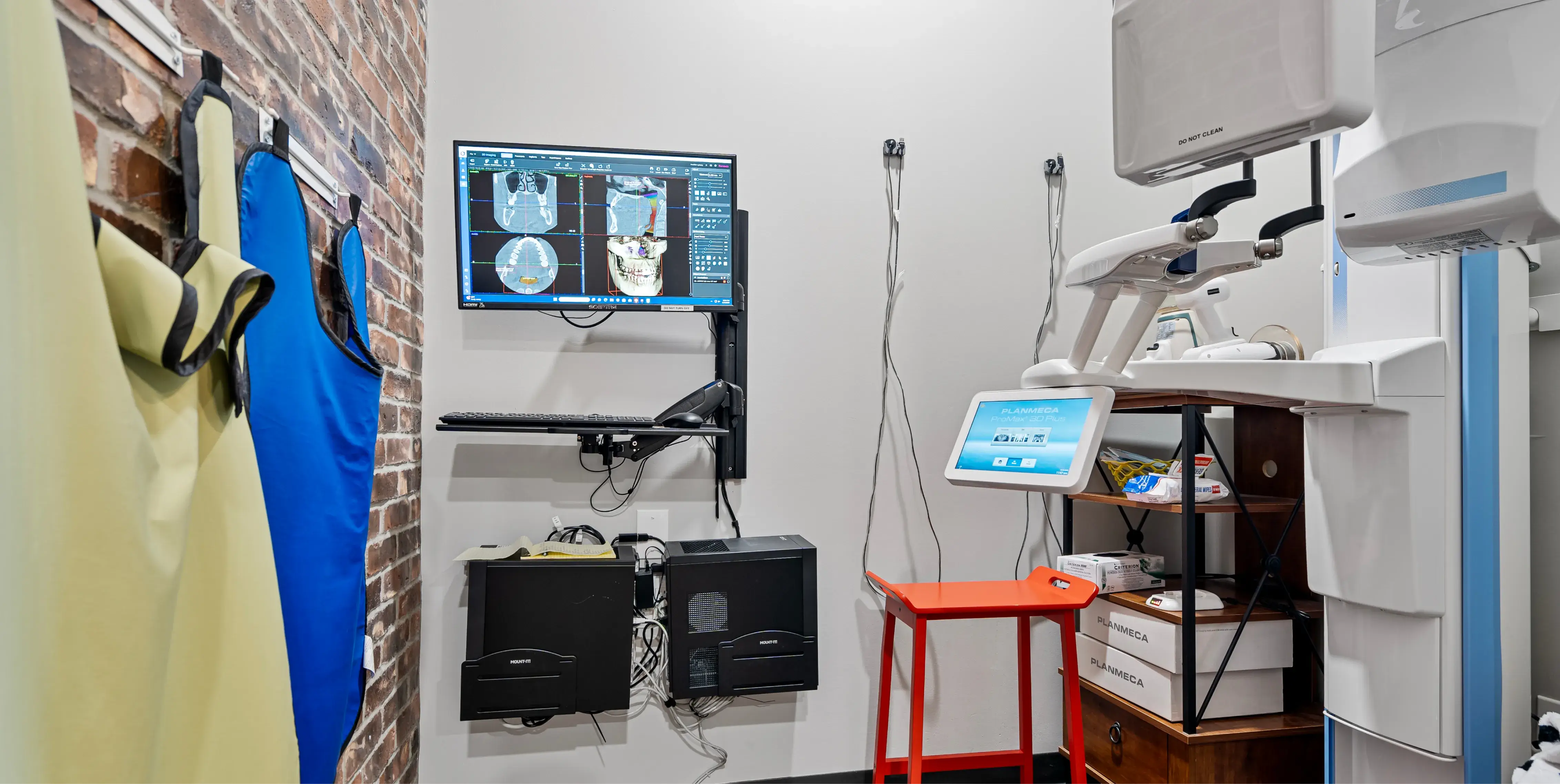 a medical room with a monitor and medical equipment