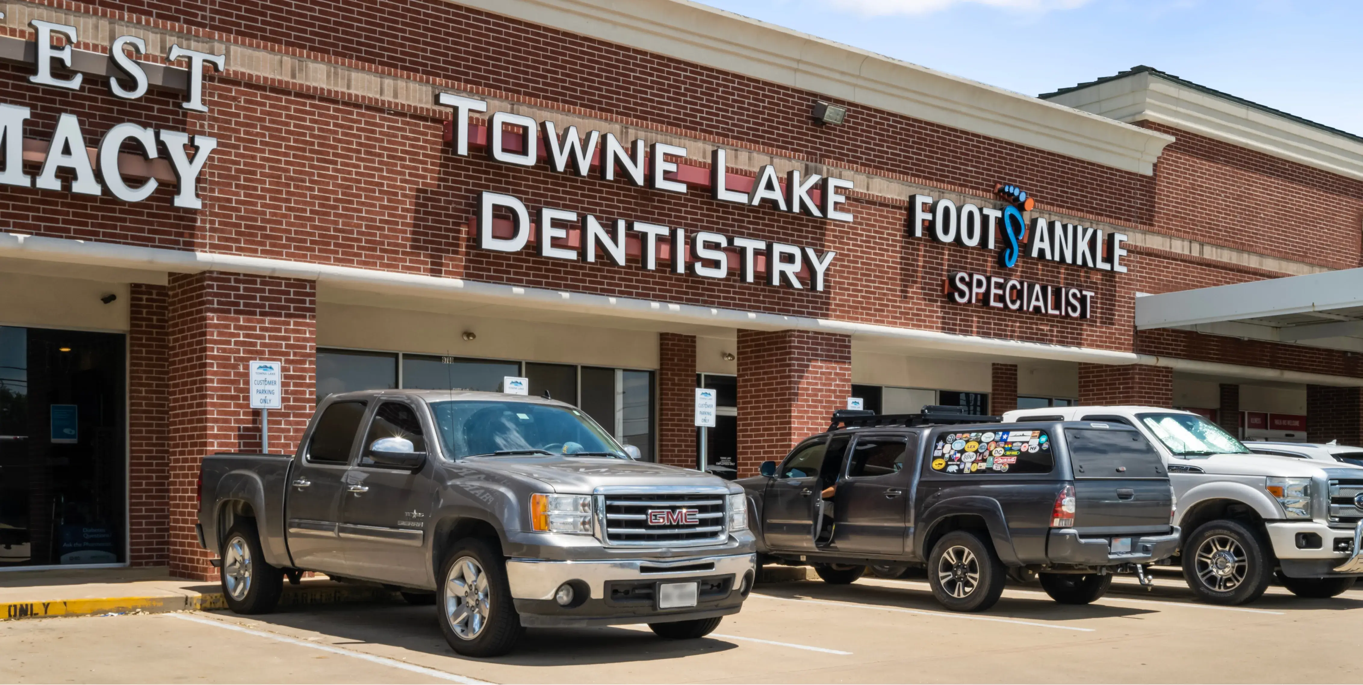 a couple of trucks parked in front of a building