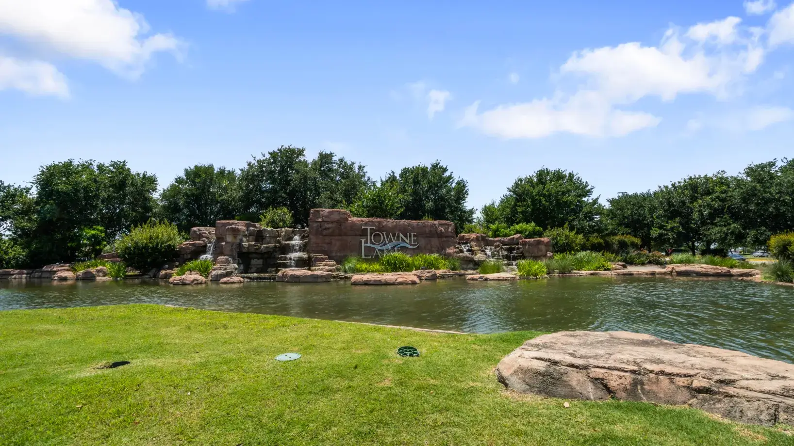 a pond with a sign that says jungle on it